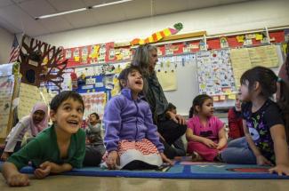 Teacher Carol Hunt encourages students in her kindergarten class to emulate wild animals during an arts-integrated math lesson at Westlawn Elementary School on Feb. 18 in Falls Church, Va. (Bill O'Leary/The Washington Post)