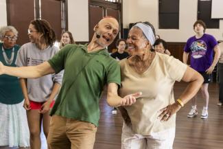 Fuad dancing with students