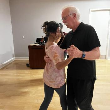 Roy Segar dancing with new student